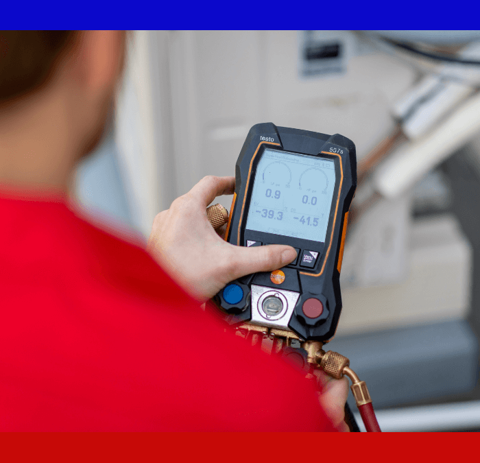 HVAC Master technician checking the output of an HVAC unit