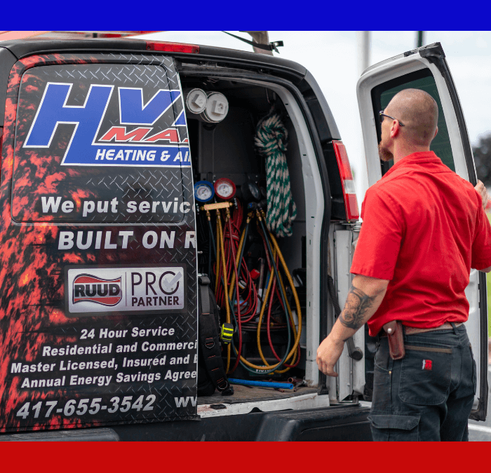 HVAC Master technician closing work van doors.