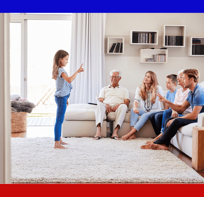 Family playing chirades in clean, comfortable home.